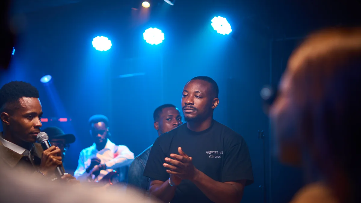Jesus Breed and the room gathered in worship under stage lights