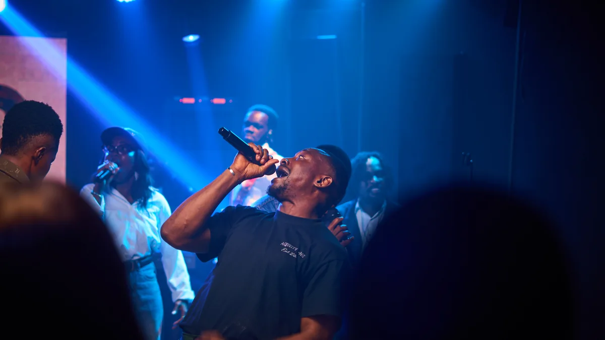 Richard Michael singing mid-ministration as the room worships